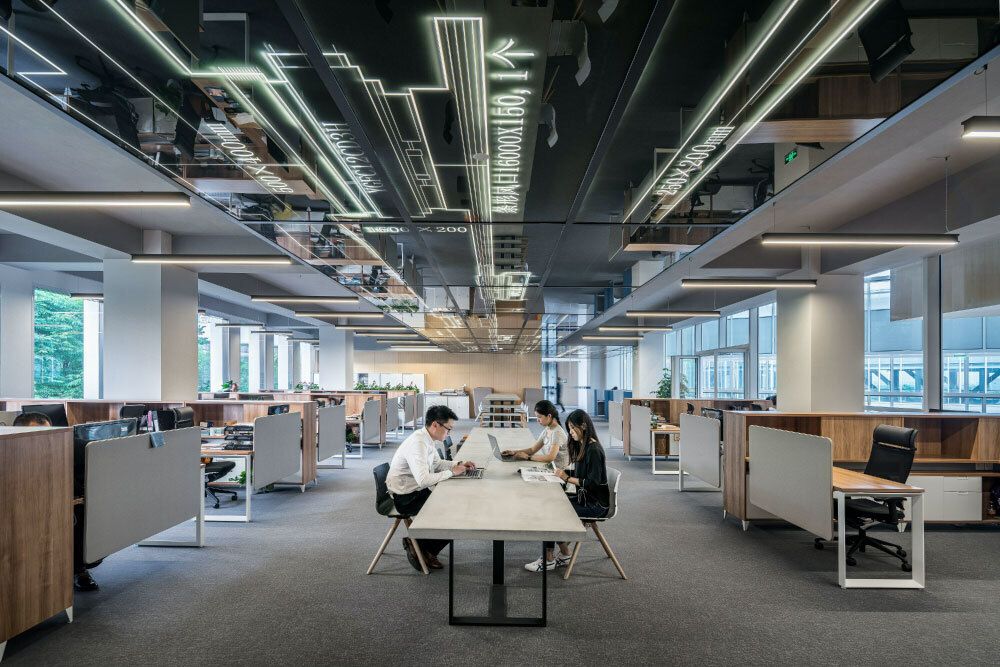 People sitting at a desk in an office