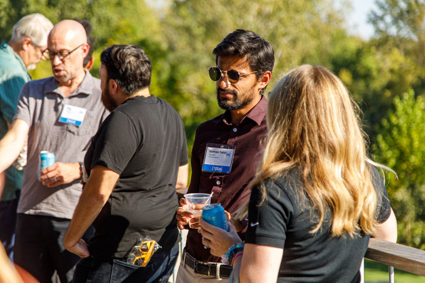 man networks on rooftop event